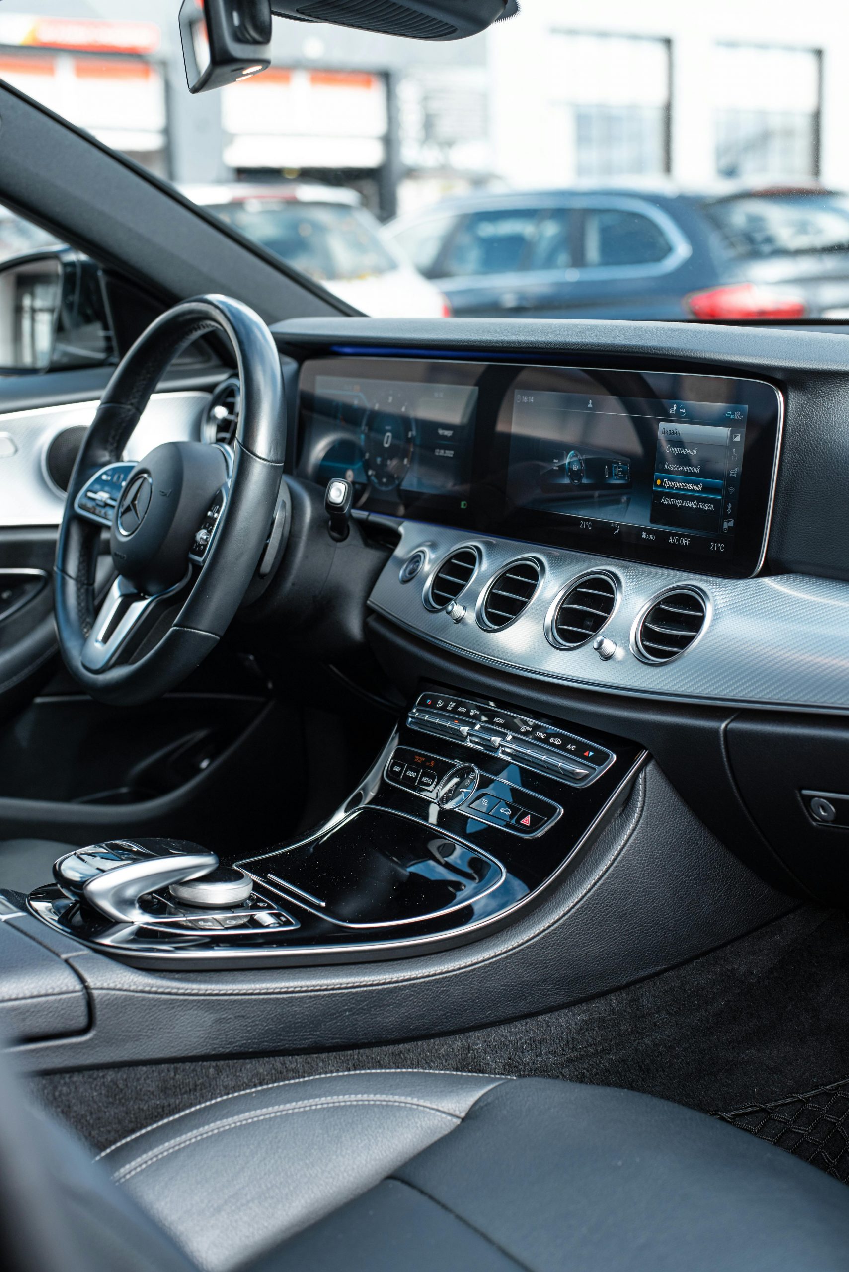Explore the sleek interior of a luxury car featuring high-tech dashboard and modern design elements.